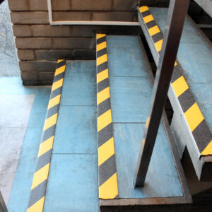 Hazardous tape on blue stair edges