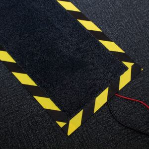 Wires covered by a hazardous marked mat