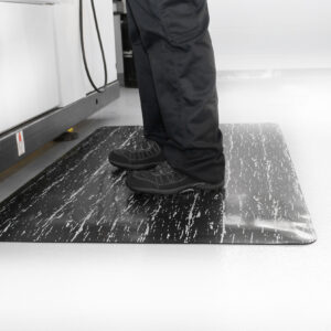 Man standing on a Marble Mat