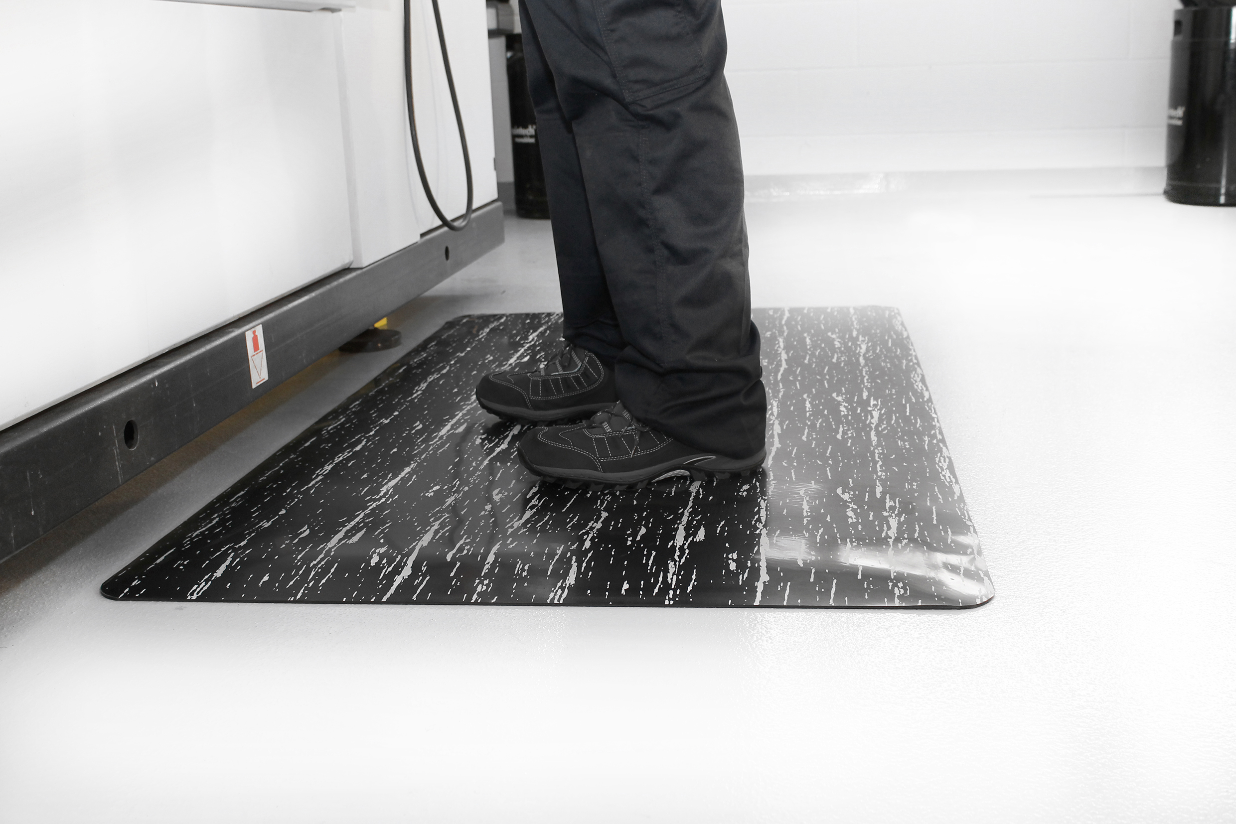 Man standing on a Marble Mat