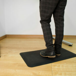 man standing on orthomat office mat